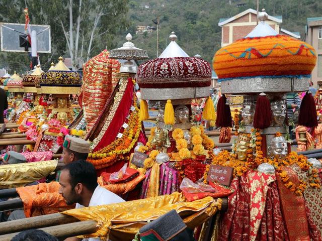 Local deities and devotees at Paddal ground during Shivratri fair on Monday. Birbal Sharma/HT