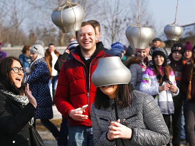 A young woman takes part in a comic contest during Maslenitsa celebrations, or Shrovetide, to say farewell to winter in the village of Ozertso, in outskirts of Minsk, Belarus. (AP photo)