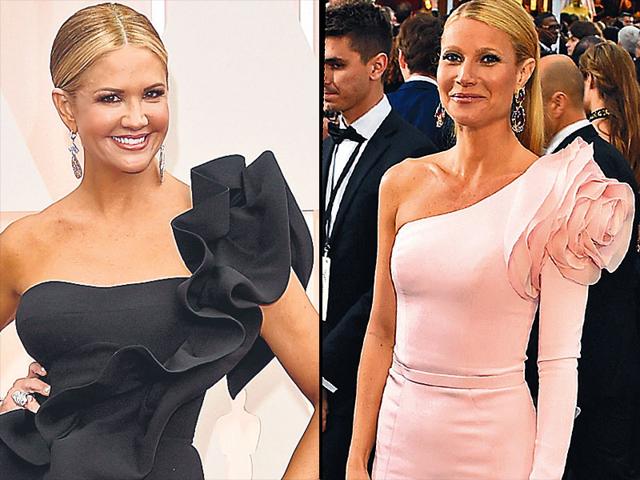 Ruffle power: Actor Gwyneth Paltrow (R) opted for a one-sleeved Ralph & Russo gown with a large ruffled rosette. Indian designers Gauri and Nainika Karan’s gown also made it to the red carpet. TV host Nancy O’Dell (L) wore a black gown with ruffle detailing created by the duo. Ruffle power: Actor Gwyneth Paltrow (R) opted for a one-sleeved Ralph & Russo gown with a large ruffled rosette. Indian designers Gauri and Nainika Karan’s gown also made it to the red carpet. TV host Nancy O’Dell (L) wore a black gown with ruffle detailing created by the duo.