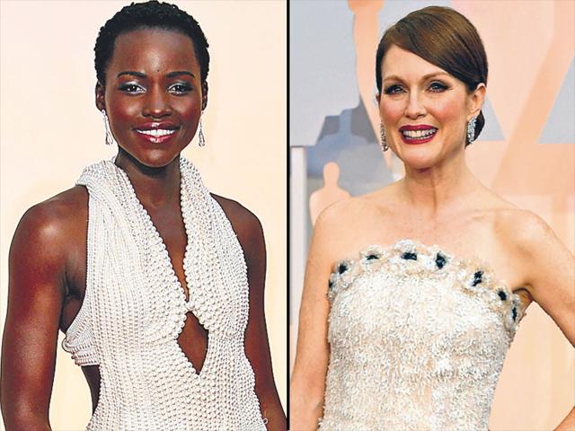 Old-world elegance: While fashion’s darling Lupita Nyong’o (L) wowed everyone in her pearl encrusted Calvin Klein dress, actor Julianne Moore (R) rocked a Chanel gown made with floral detailing of organza, tulle and sequins. Old-world elegance: While fashion’s darling Lupita Nyong’o (L) wowed everyone in her pearl encrusted Calvin Klein dress, actor Julianne Moore (R) rocked a Chanel gown made with floral detailing of organza, tulle and sequins.