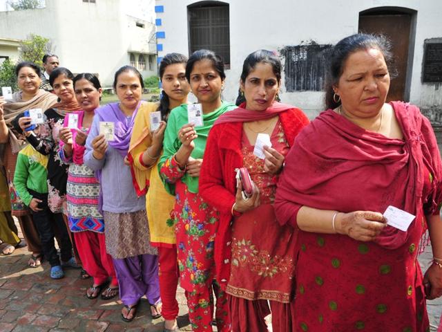 Voters showing voter slips at a polling booth in Santa Majra in Kharar during MC Polls on Wednesday. Gurpreet Singh/HT