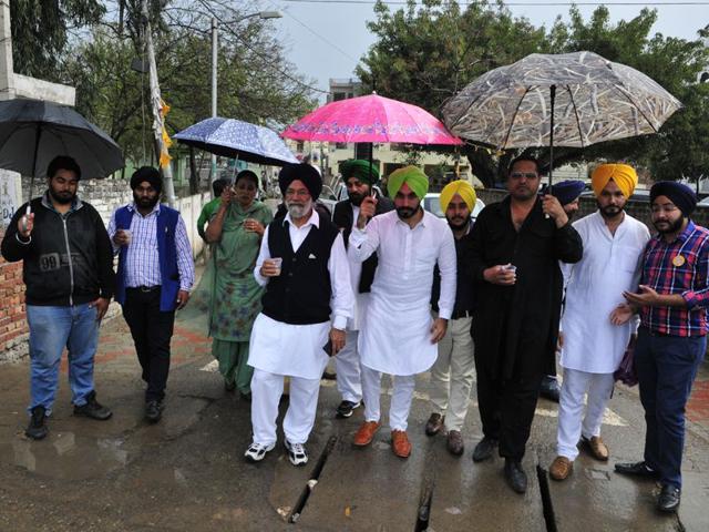 Voters showing voter slips at a polling booth in Santa Majra in Kharar during civic polls on Wednesday. Gurpreet Singh/HT