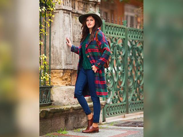 Emerald: This emerald, red coat and skinny jeans combo has cowboy chic written all over it. (AFP)