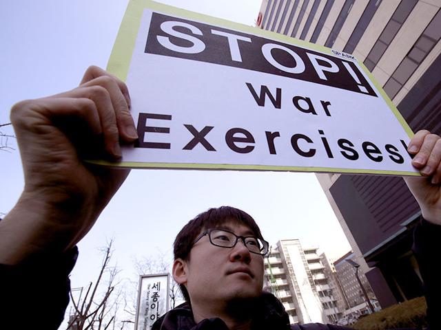 A-protester-holds-a-sign-to-denounce-the-annual-joint-military-exercises-dubbed-Key-Resolve-and-Foal-Eagle-between-South-Korea-and-the-United-States-during-a-rally-near-US-Embassy-in-Seoul-South-Korea-AP-Photo