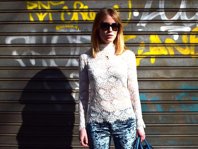 A semi-sheer laced top clashes with a tie-dyed denim pattern for a stylish take on grunge. 
