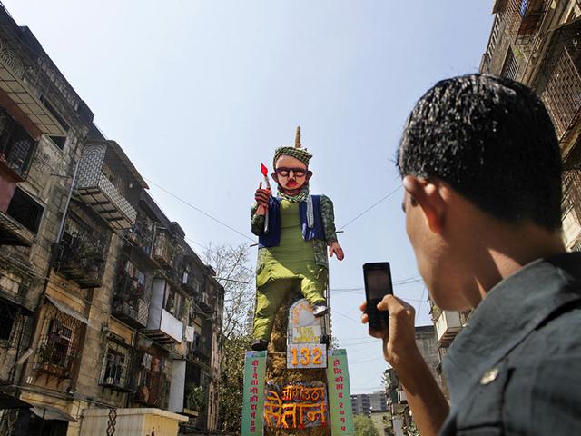 A 55-feet-effigy of the terrorist who attacked a school in Peshawar, Pakistan was erected to be burnt as part of Holi festivities at Worli, Mumbai. (Kalpak Pathak/HT photo)