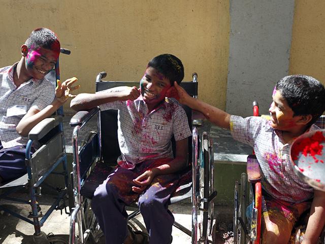 Disabled children celebrated Holi, the festival of colours at the Society for the Education of the Crippled in Agripada, Mumbai. (Vijayanand Gupta/HT photo)