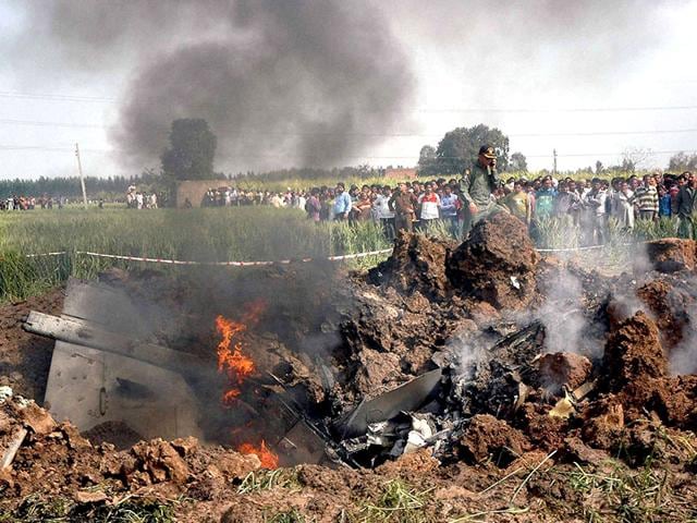 People-gather-around-the-wreckage-of-IAF-s-Jaguar-fighter-aircraft-which-crashed-in-the-fields-of-Landah-village-in-Ambala-on-Thursday-PTI-Photo