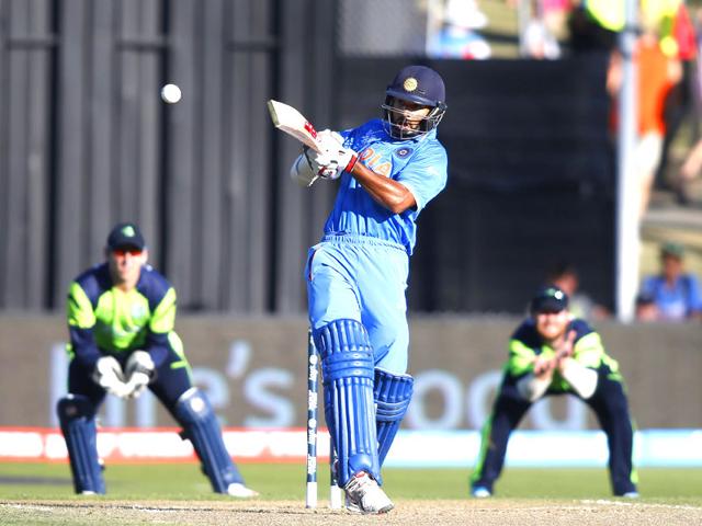 Shikhar Dhawan hits a six against Ireland during their Cricket World Cup match in Hamilton, March 10, 2015. REUTERS