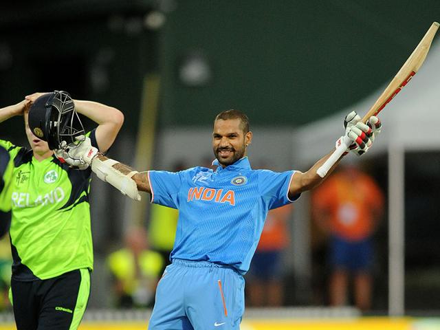 Shikhar Dhawan celebrates after scoring a century while batting against Ireland during their Cricket World Cup Pool B match in Hamilton, New Zealand. (AP Photo/Ross Setford)