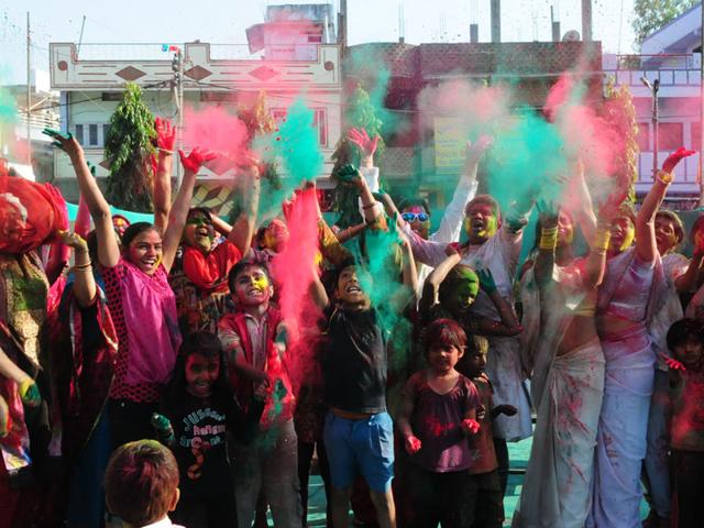 People celebrate Rang Pancahmi with zeal at Naveen Nagar in Bhopal on Tuesday. (Mujeeb Faruqui/HT photo)