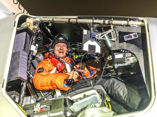 Pilot Andre Boschberg reacts after landing Solar Impulse 2 in Muscat, Oman on Monday. (AP Photo)