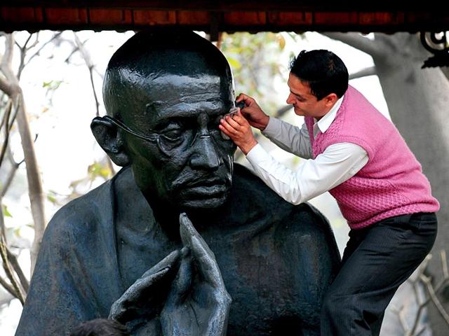 A-man-painting-the-statue-of-Mahatma-Gandhi-before-his-death-anniversary-at-The-Ridge-in-Shimla-on-Thursday-Santosh-Rawat-HT A-man-painting-the-statue-of-Mahatma-Gandhi-before-his-death-anniversary-at-The-Ridge-in-Shimla-on-Thursday-Santosh-Rawat-HT