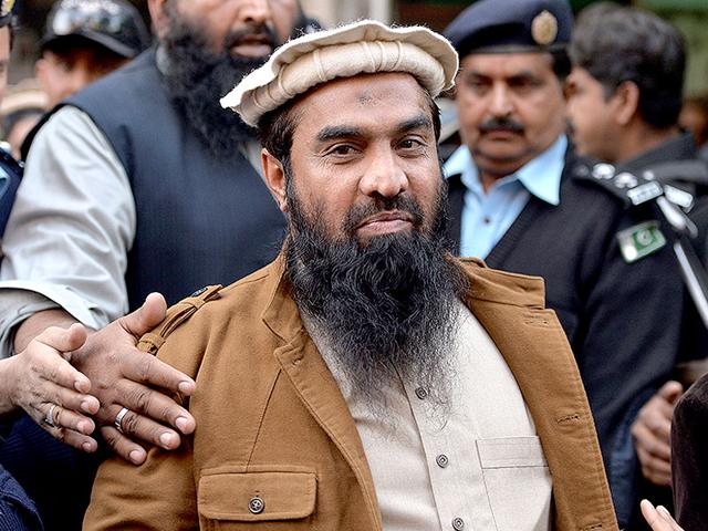 Activists-of-the-Hindu-Sena-with-portraits-of-Zaki-ur-Rahman-Lakhvi-the-chief-suspect-in-the-26-11-attacks-trial-protest-near-the-residence-of-Pakistan-High-Commissioner-in-New-Delhi-AP-Photo