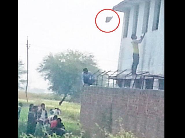 A-man-supplies-material-for-students-to-copy-Shahroz-Afridi-HT-photo A-man-supplies-material-for-students-to-copy-Shahroz-Afridi-HT-photo
