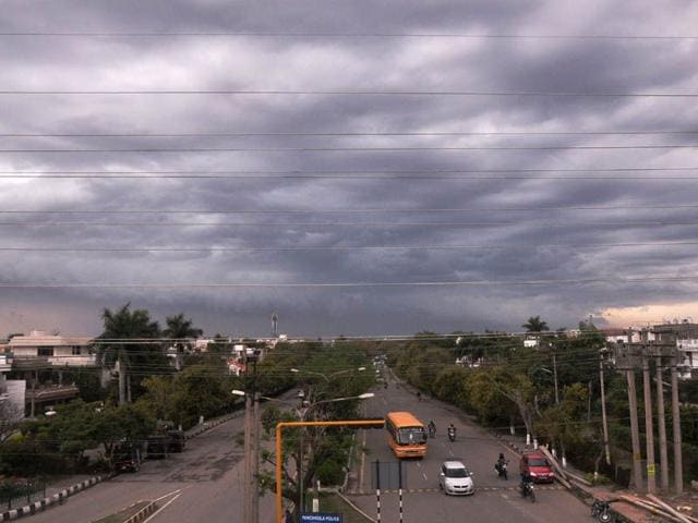 Black clouds hovering in Panchkula on Monday. Sant Arora/HT