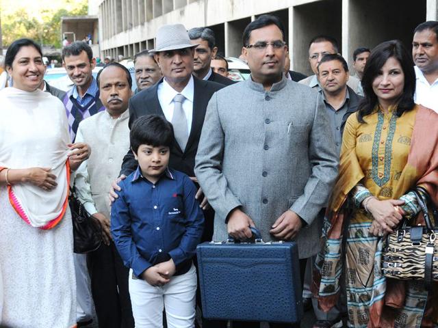 Haryana-finance-minister-Capt-Abhimanyu-accompanied-by-family-and-relatives-on-his-arrival-at-the-Vidhan-Sabha-in-Chandigarh-on-Tuesday-to-present-the-budget-for-2015-16-Sanjeev-Sharma-HT Haryana-finance-minister-Capt-Abhimanyu-accompanied-by-family-and-relatives-on-his-arrival-at-the-Vidhan-Sabha-in-Chandigarh-on-Tuesday-to-present-the-budget-for-2015-16-Sanjeev-Sharma-HT