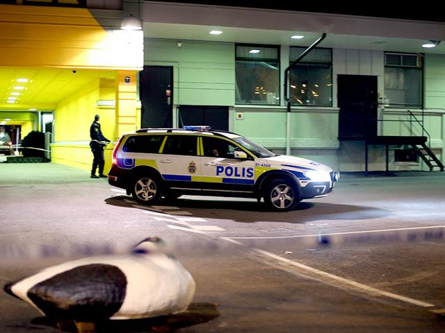 A-police-officer-examines-the-scene-of-a-fatal-shooting-in-Gothenburg-Sweden-AP-Photo