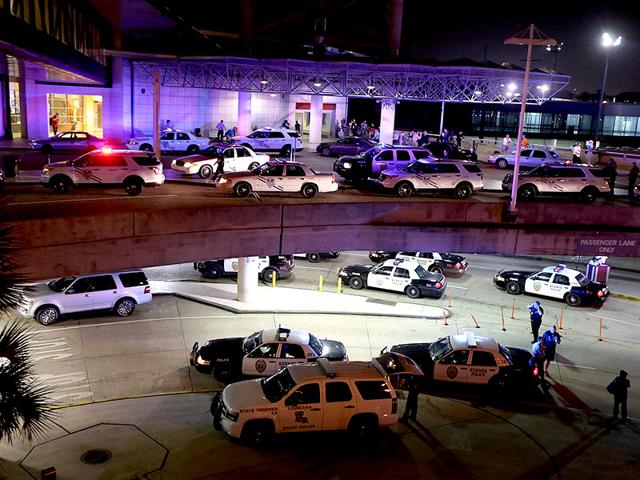 Dozens-of-police-vehicles-surround-the-entrance-of-New-Orleans-Louis-Armstrong-International-Airport-after-a-machete-wielding-man-was-shot-by-a-TSA-employee-AP-Photo