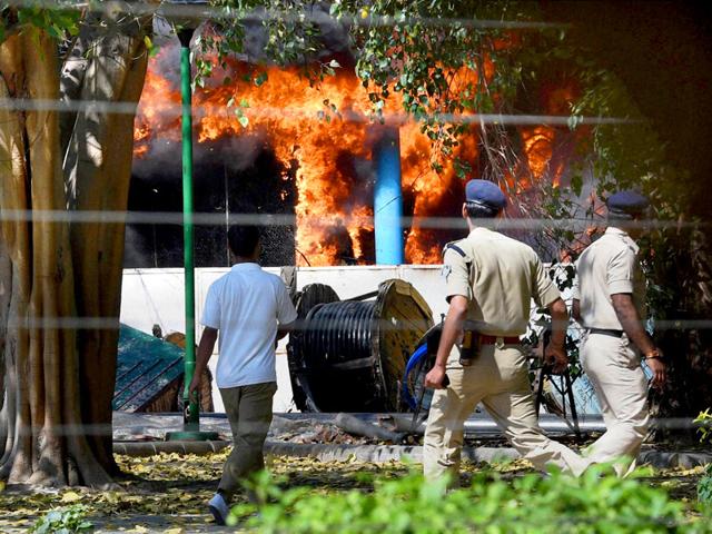 Security-personnel-rush-at-the-spot-after-a-major-fire-broke-out-in-the-AC-plant-of-Parliament-complex-in-New-Delhi-PTI-Photo Security-personnel-rush-at-the-spot-after-a-major-fire-broke-out-in-the-AC-plant-of-Parliament-complex-in-New-Delhi-PTI-Photo