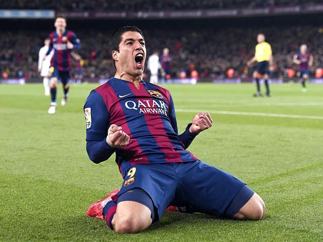 Barcelona-forward-Luis-Suarez-celebrates-his-goal-during-the-Spanish-league-football-match-FC-Barcelona-vs-Real-Madrid-CF-on-March-22-2015-AFP-PHOTO