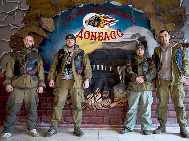 Members-of-the-Donbass-Night-Wolves-motorbike-club-pose-in-front-of-the-gate-of-the-club-s-base-in-Lugansk-AFP-photo