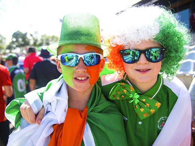 Young Irish fans pose for a photo during the Pool play 2015 Cricket World Cup match between Ireland and the West Indies at Saxton Park Oval in Nelson, New Zealand on February 16, 2015. AFP PHOTO