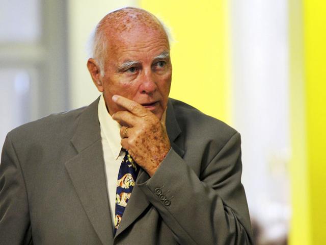 Former-grand-slam-tennis-doubles-champion-Bob-Hewitt-walks-outside-a-court-in-Johannesburg-South-Africa-AP-File-Photo