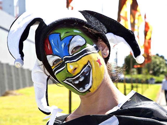 A fan with a painted face is seen outside Eden Park before the Cricket World Cup match between Australia and New Zealand in Auckland February 28, 2015. REUTERS