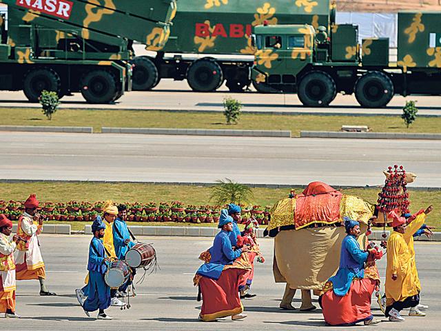 Folk artists perform during the Pakistan Day military parade in Islamabad. (AFP Photo)
