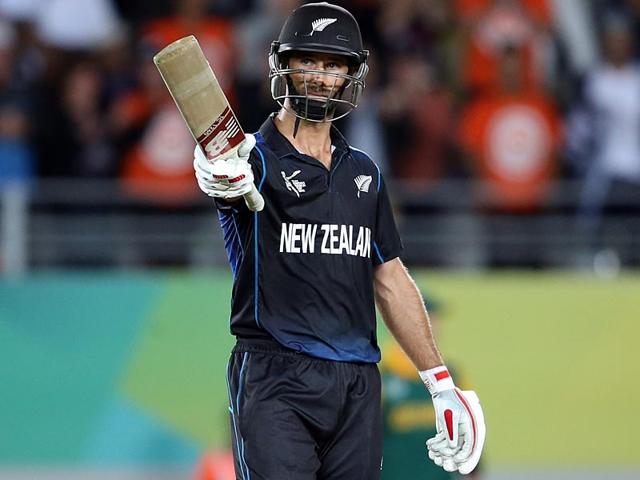 New Zealand's Grant Elliott celebrates his half century during the semi-final Cricket World Cup match between New Zealand and South Africa played at Eden Park in Auckland. (AFP Photo/ Michael Bradley)