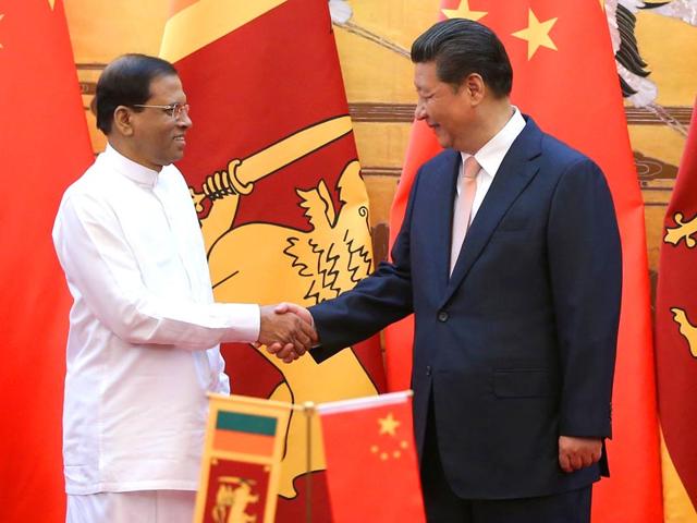 Sri-Lankan-president-Maithripala-Sirisena-shakes-hands-with-Chinese-president-Xi-Jinping-during-a-signing-ceremony-in-the-Great-Hall-of-the-People-in-Beijing-AFP-Photo