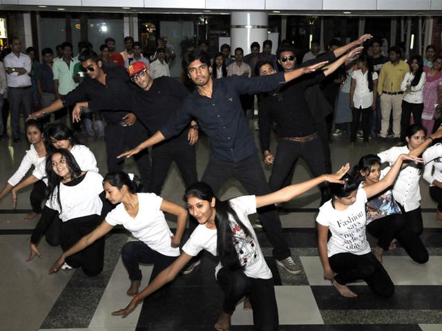 Members of Young India group present street play as part of celebrations on the eve of Earth Hour, in Indore on Friday. (Shankar Mourya/HT photo)