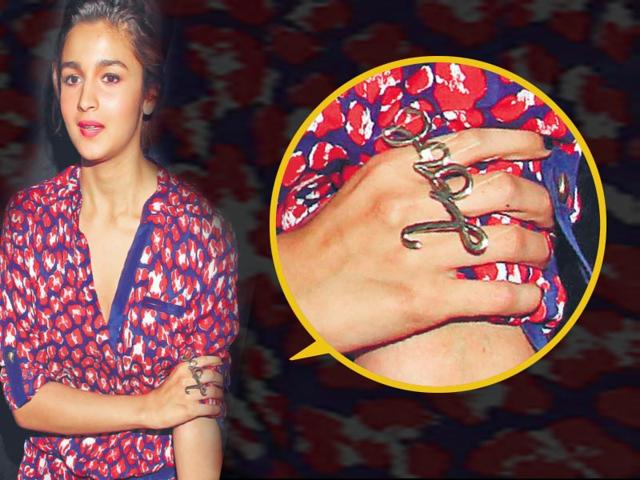 Bored of rocking a simple love band or a diamond solitaire on your fingers? If so, then it's time to bling up your ring game. Put away those oh-so-cliché layered necklaces and chandelier earrings, and instead dress up with a statement ring. If you don't quite know how to ace this trend, here's some celeb-inspiration. (Text: Anjali Thakur) Alia Bhatt: Whether she's hitting the red carpet or just enjoying some downtime, we can't get enough of Alia Bhatt's style. The actor opted for knuckle statement rings, which she paired with a printed romper and white pumps.