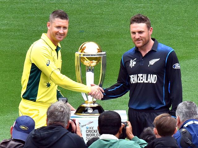Australian-captain-Michael-Clarke-L-and-New-Zealand-captain-Brendon-McCullum-shake-hands-during-a-photo-session-with-the-ICC-Cricket-World-Cup-2015-trophy-at-the-Melbourne-Cricket-Ground-MCG-ahead-of-the-2015-Cricket-World-Cup-final-match-AFP-Photo