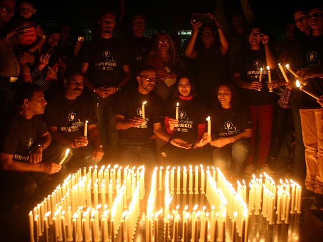Residents of Bhopal lit up candles to observe Earth Hour on Saturday. (Bidesh Manna/HT photo)