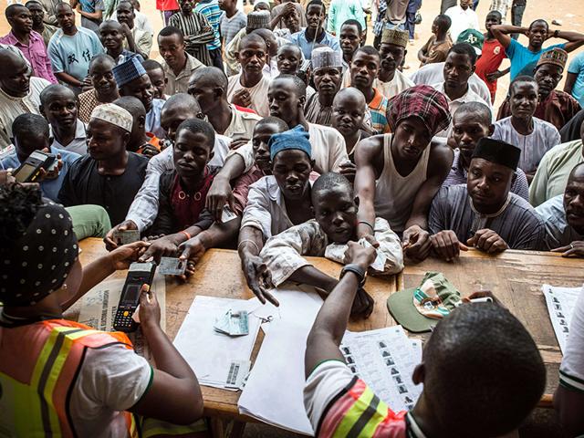 People-wait-to-vote-at-a-polling-station-in-Abuja-during-presidential-elections-AFP-Photo