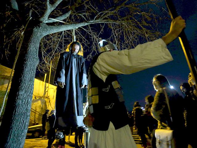 An actor portraying Judas hangs during the 'Passion of Christ' play to commemorate the crucifixion of Jesus Christ in Imotski, south Croatia. Agency Photo