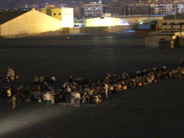 Indian nationals on the jetty at the Aden harbour waiting to board INS Sumitra. (Photo credit- Indian Navy) Indian nationals on the jetty at the Aden harbour waiting to board INS Sumitra. (Photo credit- Indian Navy)