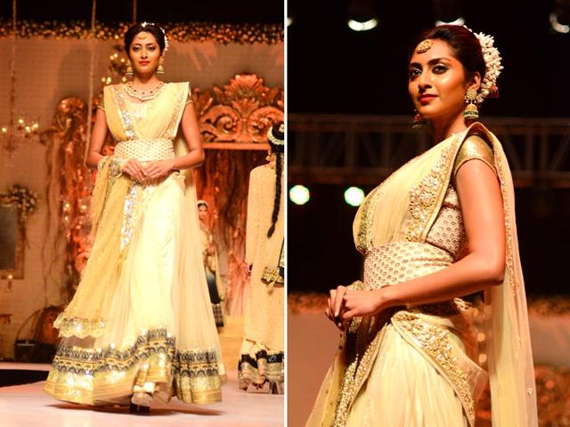 A Model walks the ramp in a shimmery off white outfit by fashion designer Vikram Phadnis at Wedding Fair 2015 in Mumbai. (IANS)
