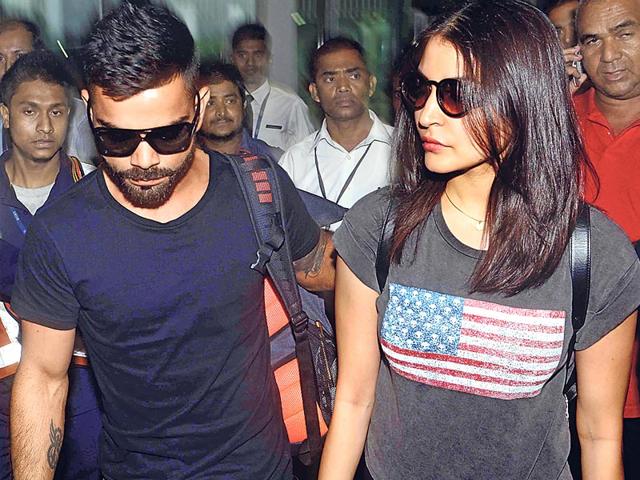 Virat Kohli and Anushka Sharma arrive at the Kolkata airport to attend the opening ceremony of the Indian Premier League. (Photo: Viral Bhayani)