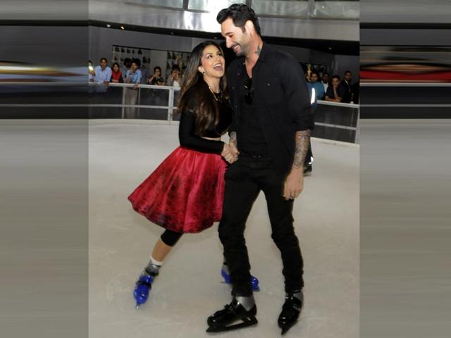 Sunny Leone and her husband Daniel Weber ice skate during the promotion of her next film,Ek Paheli Leela. The actor plays three different roles in the film. (HT photo)