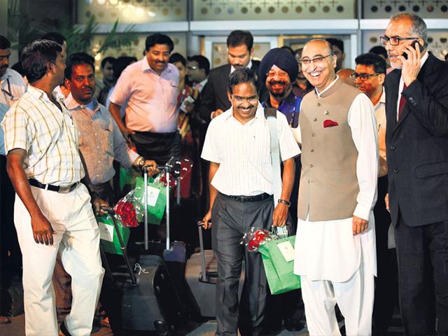 11-Indians-evacuated-by-a-Pakistani-naval-ship-from-Yemen-are-greeted-by-Pakistan-s-ambassador-to-India-Abdul-Basit-after-their-arrival-in-New-Delhi-RAJ-K-Raj-HT-Photo 11-Indians-evacuated-by-a-Pakistani-naval-ship-from-Yemen-are-greeted-by-Pakistan-s-ambassador-to-India-Abdul-Basit-after-their-arrival-in-New-Delhi-RAJ-K-Raj-HT-Photo