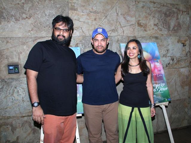 Filmmakers Nilesh Maniyar and Sonali Bose with actor Aamir Khan during the special screening of film Margarita With A Straw in Mumbai on April 8, 2015. (Photo: IANS)