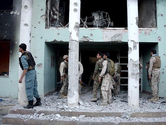 Afghan-security-personnel-examine-damage-to-a-building-at-a-court-complex-following-a-suicide-attack-in-Mazar-i-sharif-on-April-9-2015-At-least-10-people-died-April-9-2015-when-Taliban-insurgents-wearing-military-uniforms-mounted-a-six-hour-gun-and-grenade-siege-on-a-court-complex-in-northern-Afghanistan-an-assault-highlighting-the-country-s-fragile-security-situation-AFP-Photo Afghan-security-personnel-examine-damage-to-a-building-at-a-court-complex-following-a-suicide-attack-in-Mazar-i-sharif-on-April-9-2015-At-least-10-people-died-April-9-2015-when-Taliban-insurgents-wearing-military-uniforms-mounted-a-six-hour-gun-and-grenade-siege-on-a-court-complex-in-northern-Afghanistan-an-assault-highlighting-the-country-s-fragile-security-situation-AFP-Photo