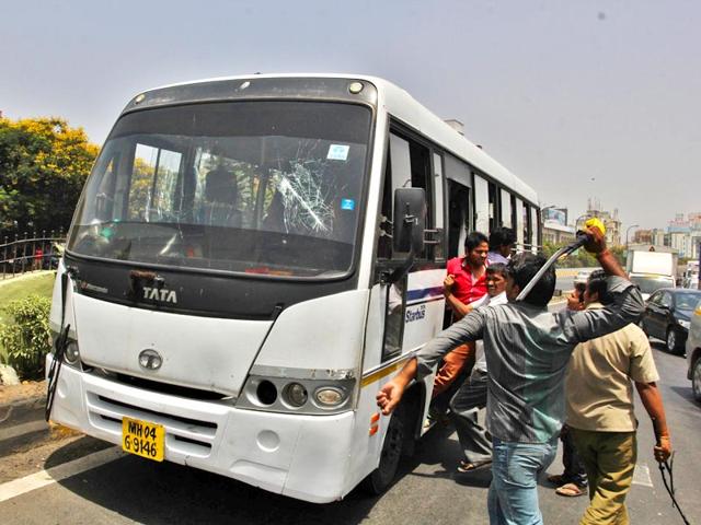 Autorickshaw unions in Thane staged a flash strike and a massive protest. The protesters threw stones and vandalised private buses, bringing the city to a standstill for around seven hours.(Praful Gangurde/HT photo)