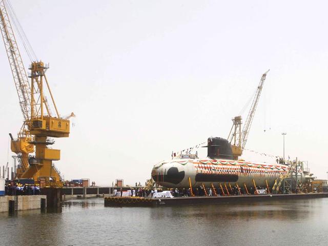 India’s first Scorpene submarine, which can carry 18 torpedoes and travel 1,020 kilometres underwater, was floated at the Mazagon Docks in Mumbai. (Pratham Gokhale/HT photo)