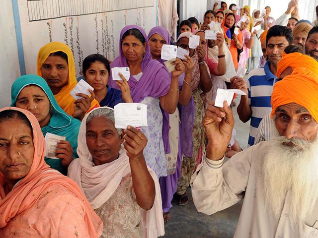 Residents-showing-voter-slips-during-polling-at-Bugra-village-in-Dhuri-on-Saturday-Bharat-Bhushan-HT-Photo