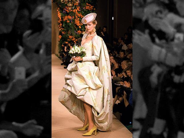 1997: A wedding gown in a white and gold floral print fabric from the Yves Saint Laurent haute couture spring-summer 1997 collection. 1997: A wedding gown in a white and gold floral print fabric from the Yves Saint Laurent haute couture spring-summer 1997 collection.