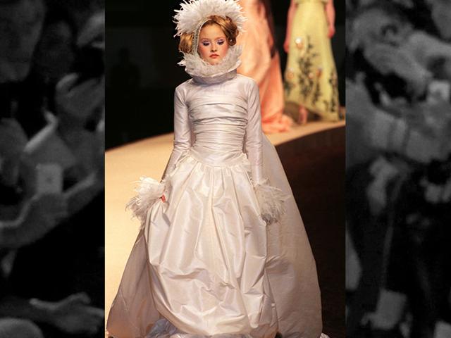 2000: A show-stopping wedding gown accented with feathers and ruched details, designed by Karl Lagerfeld for the Chanel haute couture spring-summer 2000 collection. 2000: A show-stopping wedding gown accented with feathers and ruched details, designed by Karl Lagerfeld for the Chanel haute couture spring-summer 2000 collection.